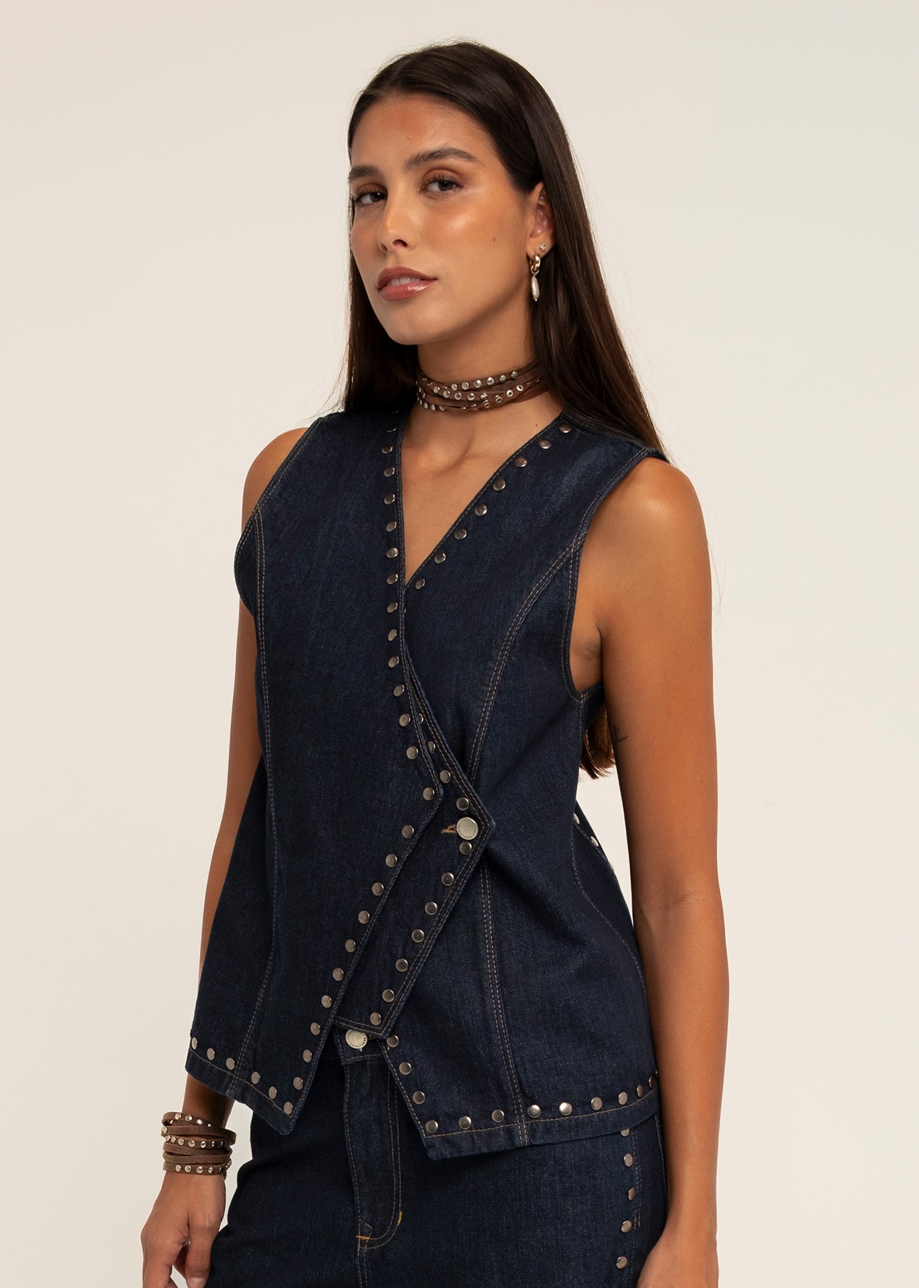 STUDDED ASYMMETRICAL DARK DENIM VEST